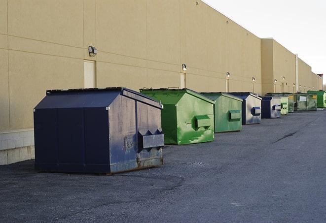 several large trash cans setup for proper construction site cleanup in Fischer TX